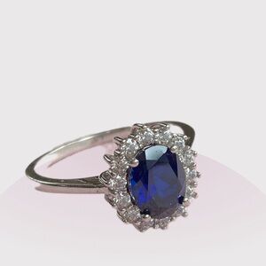 Sterling Silver and Blue Crystal Ring 
Size 10.5